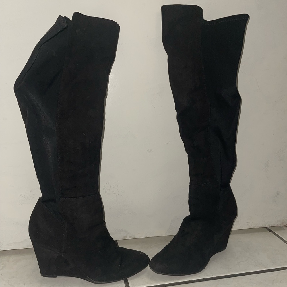 Knee length heeled boots